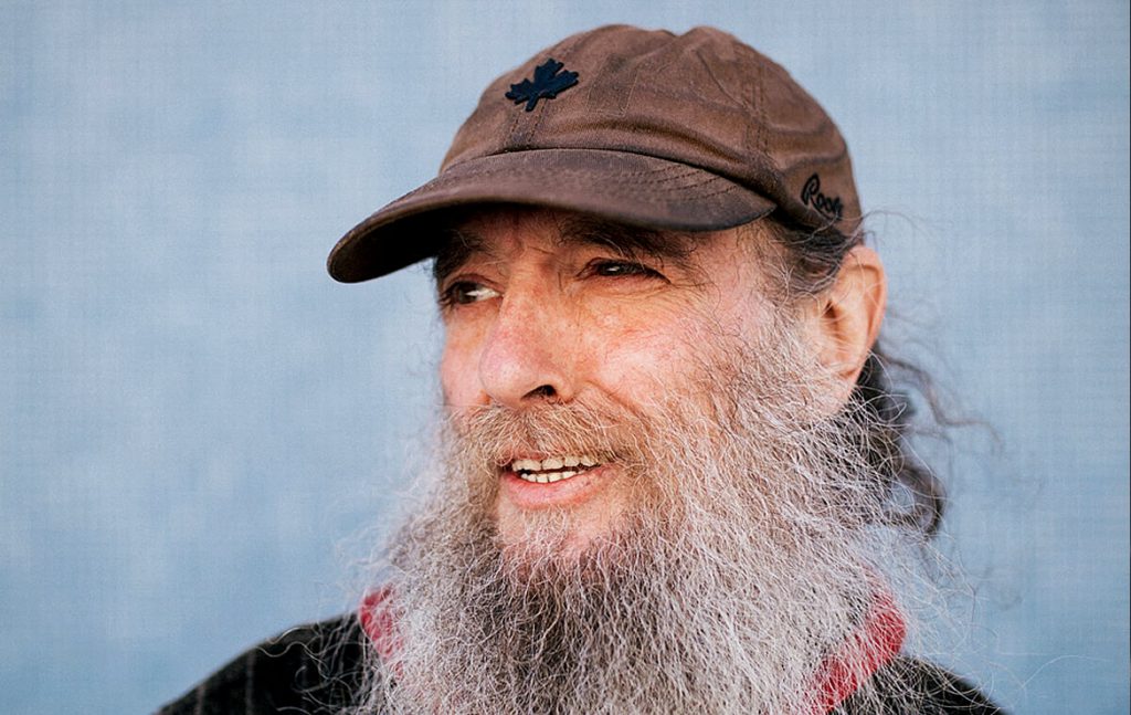 A photo of Mike wearing a baseball cap.